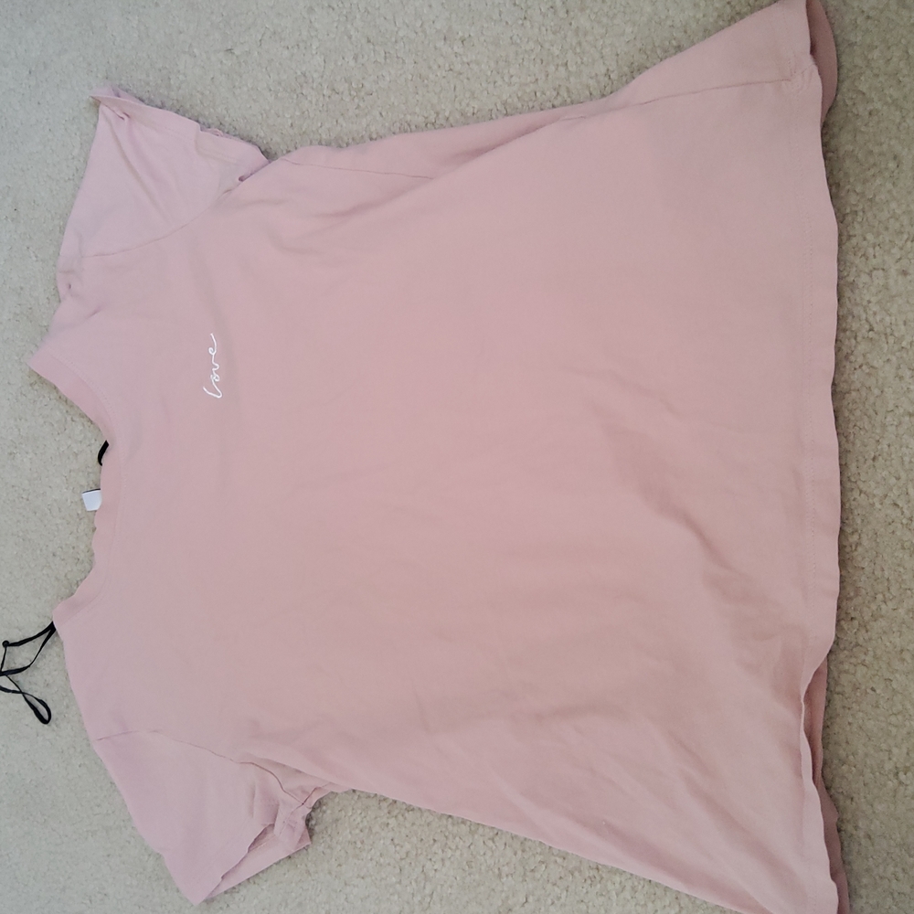 Is a light pink T-shirt